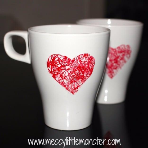 Plain white mug with a hand scribbled red heart drawn on the side, an easy handmade Valentine gift as a homemade gift