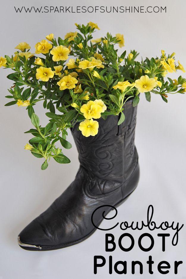 Cowboy boot planter, a worn black cowboy boot planted with trailing yellow Calibrachoa flowers on a pale surface