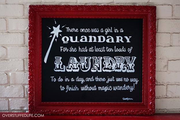 Faux chalkboard art with sharpie pens, a red framed black canvas hand lettered in white with a laundry room rhyme