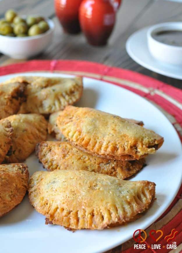 Beef and chorizo low carb empanadas made with almond flour dough, baked golden on a sheet pan, gluten free