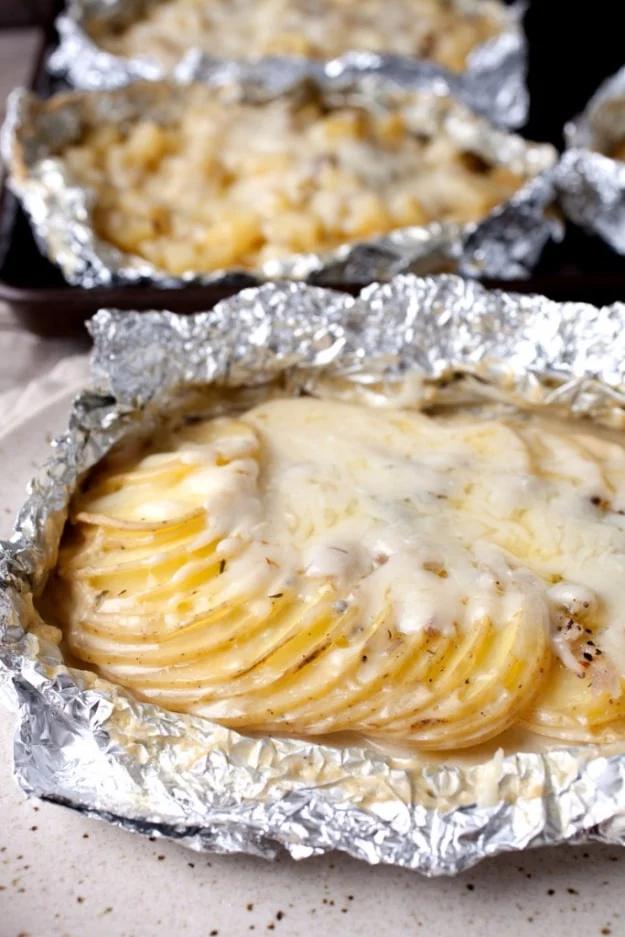 Potatoes au gratin sealed in a foil packet and grilled for a creamy campfire side dish with no cleanup