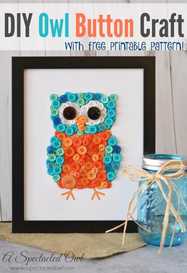 DIY owl button craft, an owl made of blue and orange buttons in a black frame beside a blue mason jar with raffia