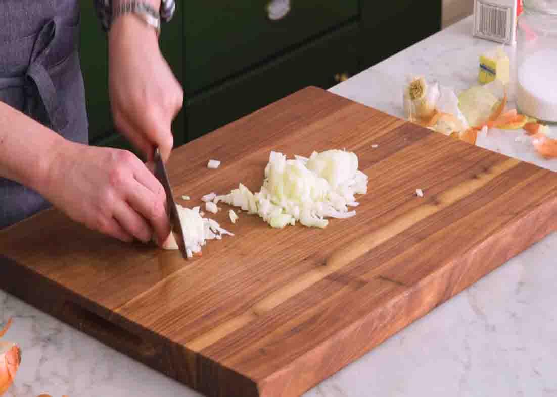 Chopping the onions for the tomato soup
