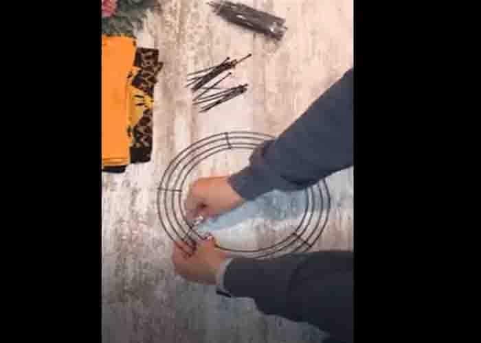 Attaching the zip ties to wire wreath