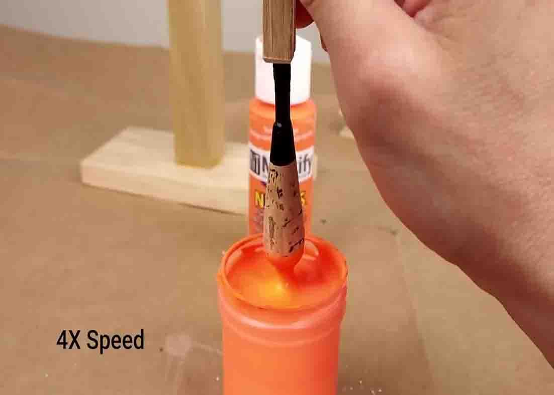 Painting the bottom of the wine corks