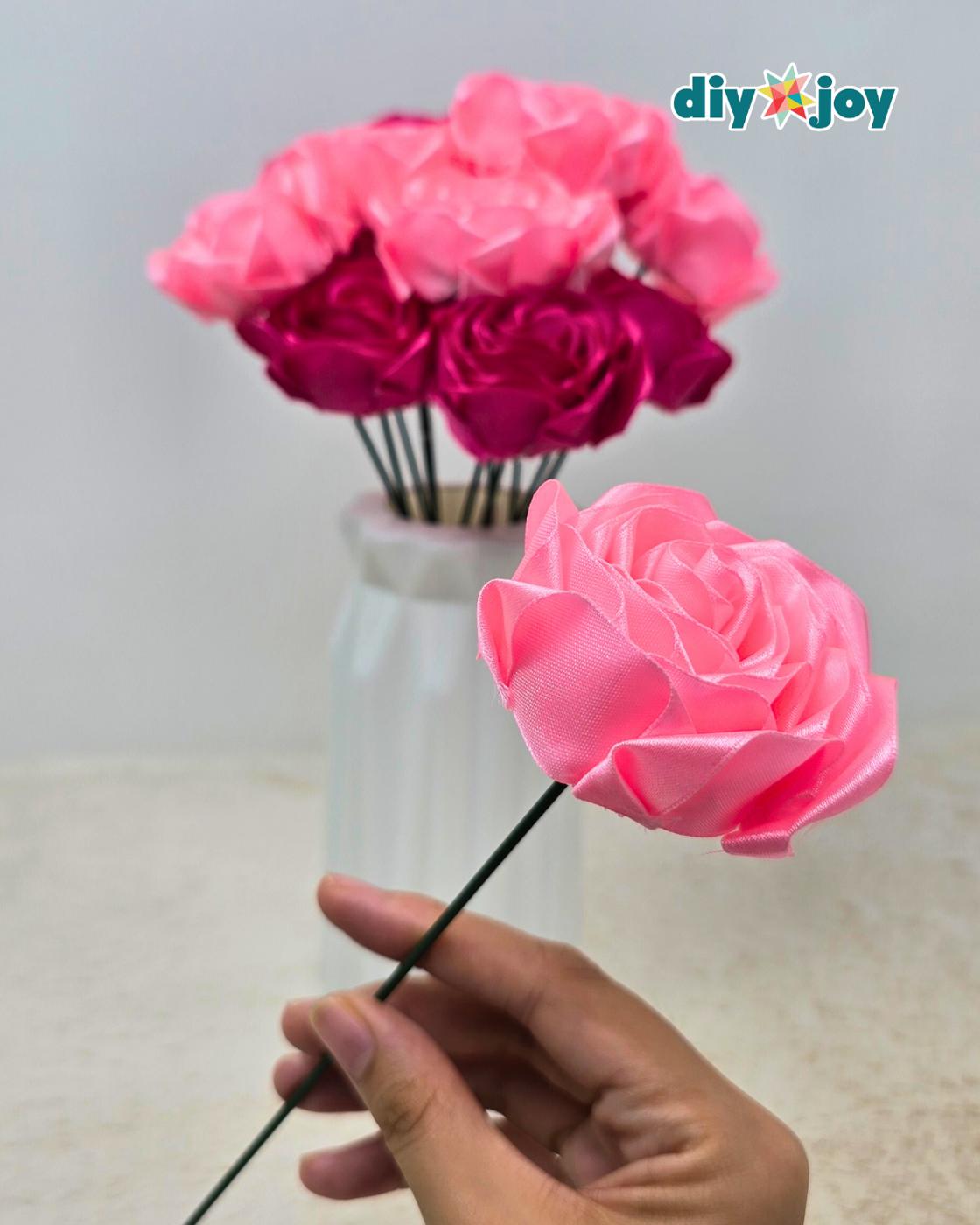Quick DIY satin ribbon flower for any occasion, a finished ribbon rose styled with other handmade crafts