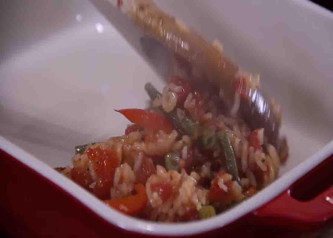 Transferring the Italian sausage mixture on the casserole dish