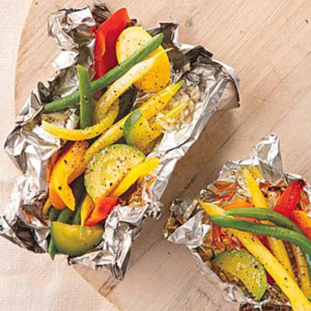 Grilled vegetables sealed in a foil packet for an easy healthy campfire side dish with almost no prep