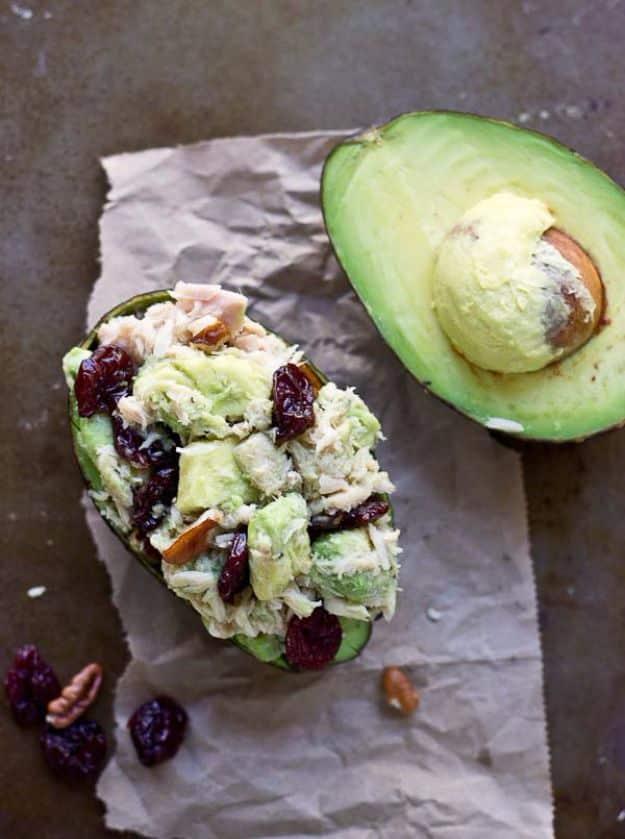 Tart cherry tuna salad served in an avocado half with chopped pecans, a quick no cook dinner for one person