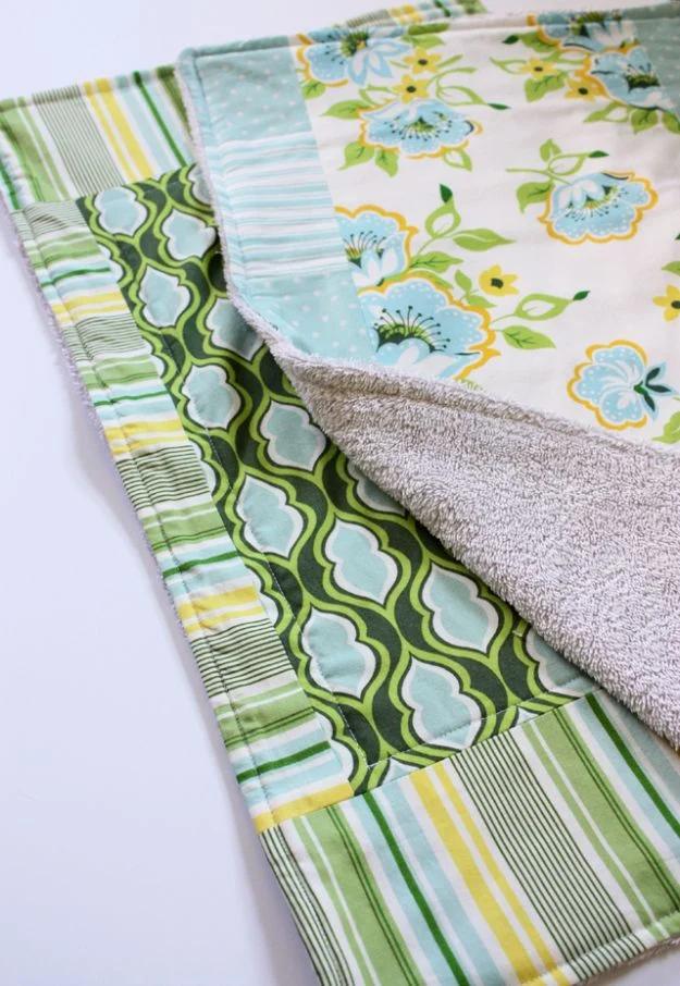 Old towels dish mat with a blue and yellow floral cotton top, folded beside a second mat in green and white stripes