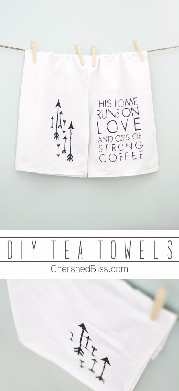 DIY sharpie tea towels, two white flour sack towels pegged on a line with black hand drawn arrows and lettering