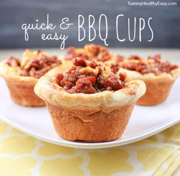 BBQ beef cups baked in canned biscuit crusts in a muffin tin and topped with melted cheese for dinner