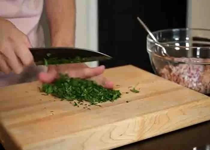 Chopping parsley for the canned tuna patties recipe
