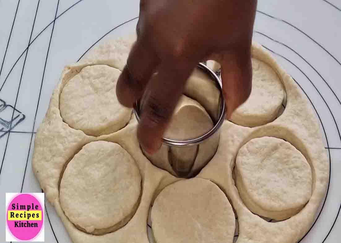 Cutting little circles from the dough for the air fryer bread recipe