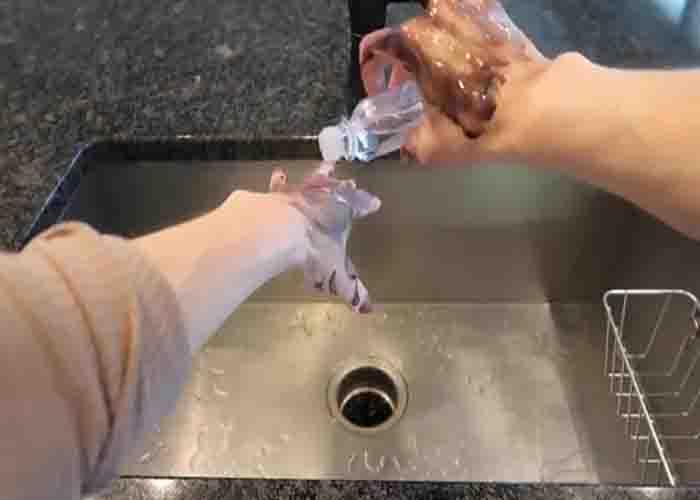 Removing grease from hands using baby oil