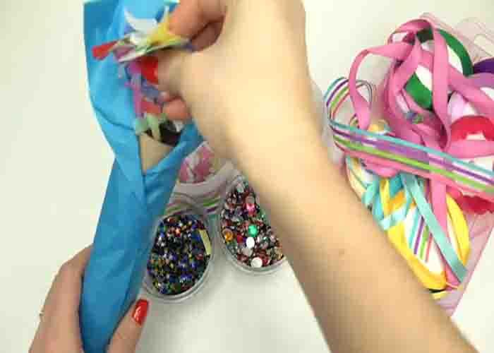 Filling the DIY new year party popper with confetti