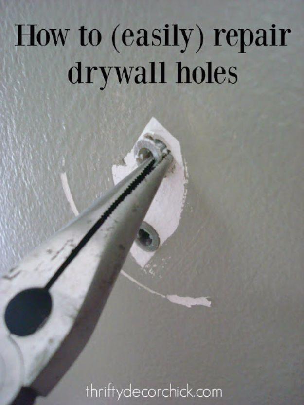 Easily patch drywall holes, needle-nose pliers gripping a wall anchor being pulled from a grey painted wall