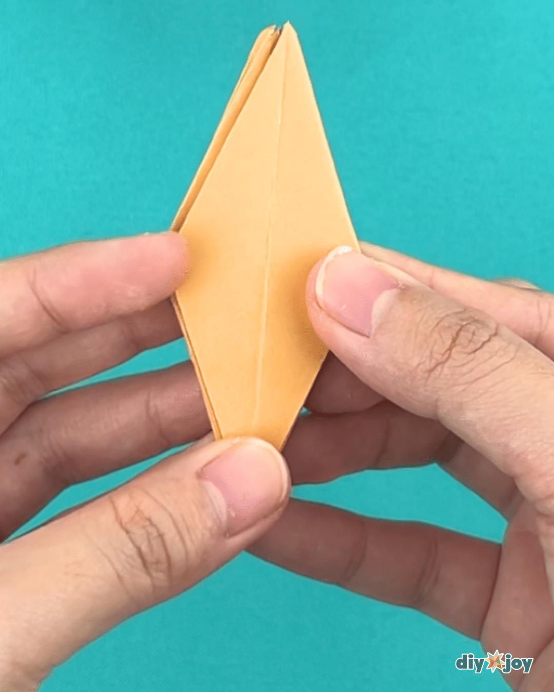 How do you make lily paper flowers, showing the flat side opened out and the sides folded in once more
