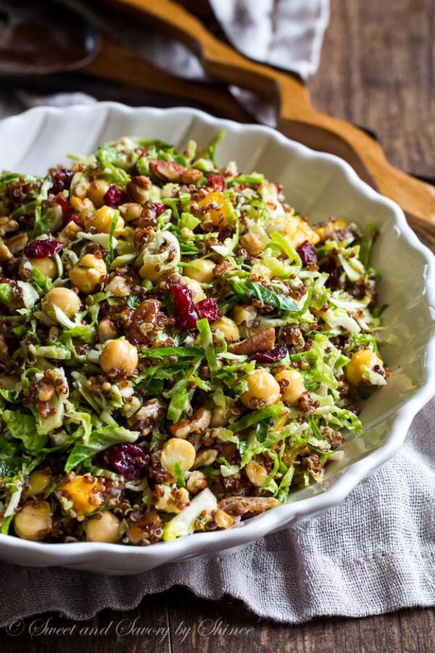 Warm quinoa and brussels sprouts salad with roasted squash, chickpeas, walnuts and dried cranberries