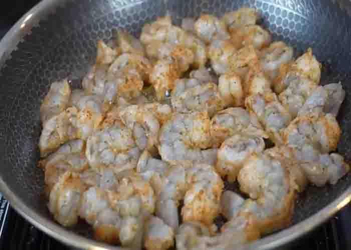 Frying the shrimp for the crab and shrimp nachos recipe