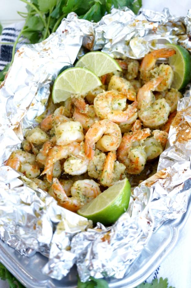 Coconut lime shrimp sealed into a foil packet for a bright tropical flavored campfire dinner outdoors