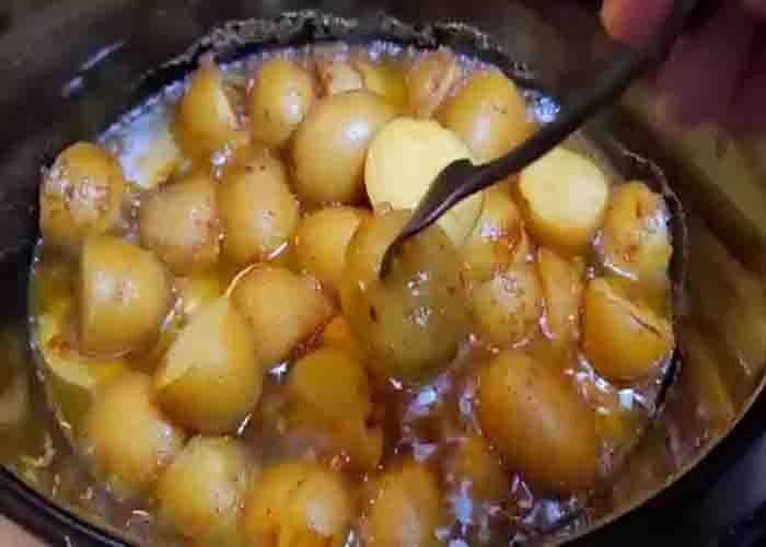 Cooking the butter herb potatoes in the slow cooker