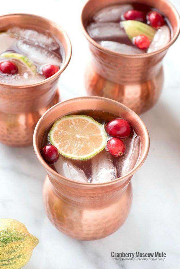Pin graphic, three copper mugs above a band reading Cranberry Moscow Mule with Homemade Cranberry Simple Syrup