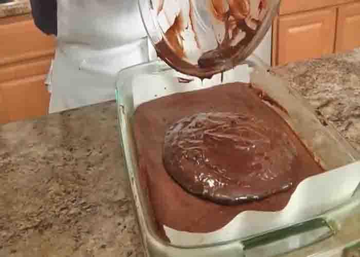Spreading the glaze over the brownie