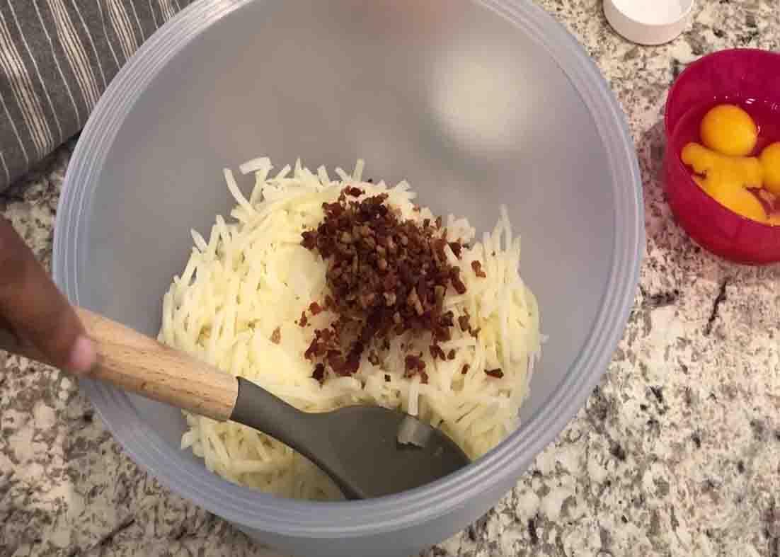 Mixing all the ingredients for the cheesy hash brown cups