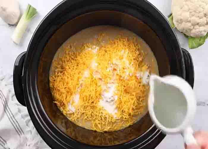 Mixing the cauliflower soup in the slow cooker