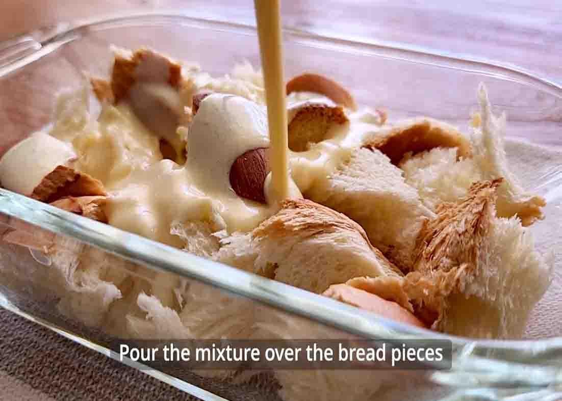 Pouring the egg mixture over the bread