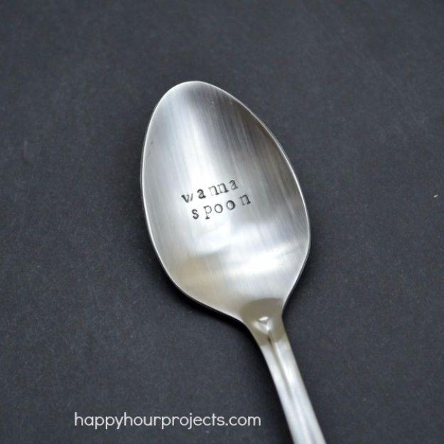 Metal teaspoons hand stamped with short love messages on the handles, a handmade Valentine gift for him