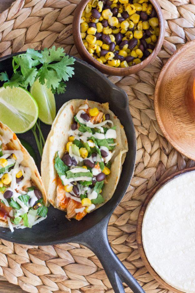 BBQ chicken tacos in doubled corn tortillas with romaine, corn, black beans and a ranch drizzle for an easy weeknight dinner