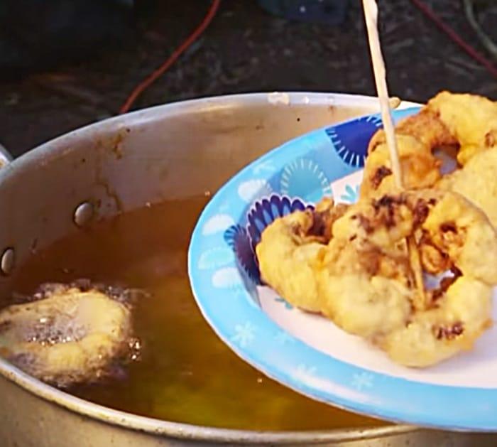 Deep fry bacon onion rings in beer batter