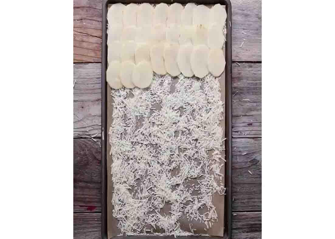 Laying out the sliced potatoes in the baking sheet