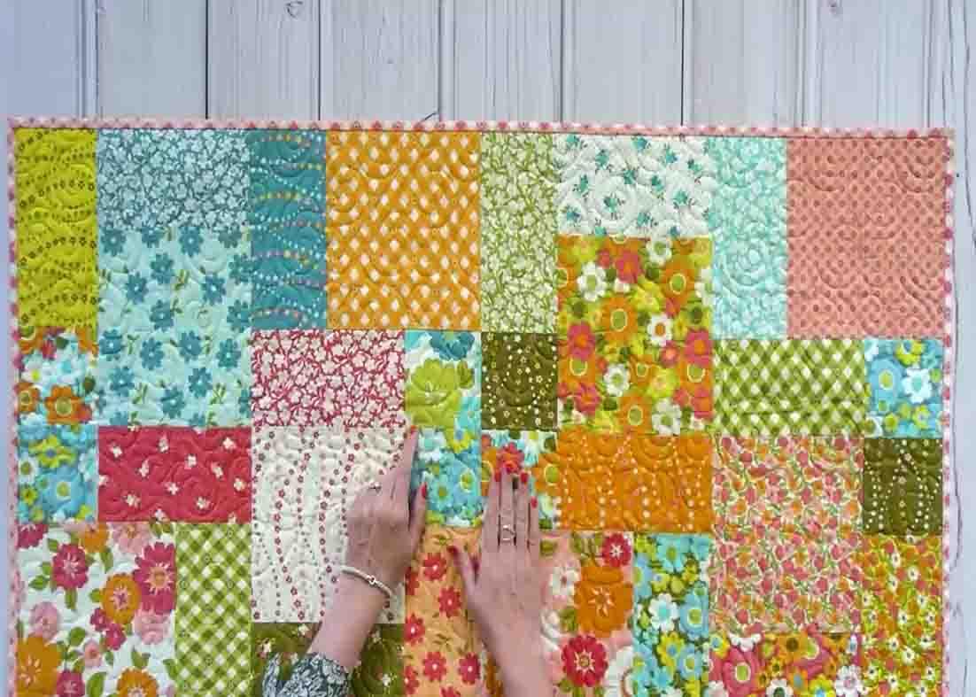 Assembling the layer cake look quilt top