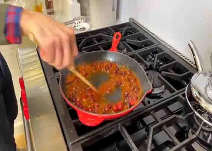 Making the cranberry sauce for the cocktail meatballs