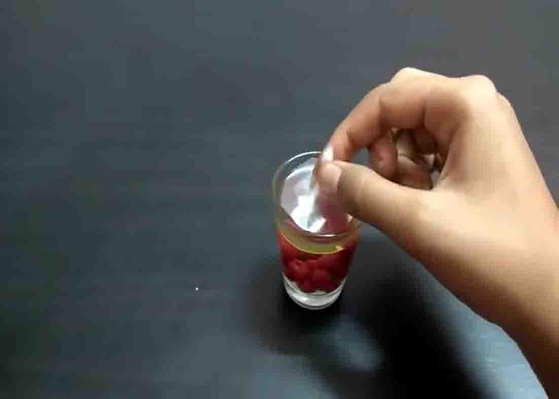 Putting the candle wick on top of the water candle