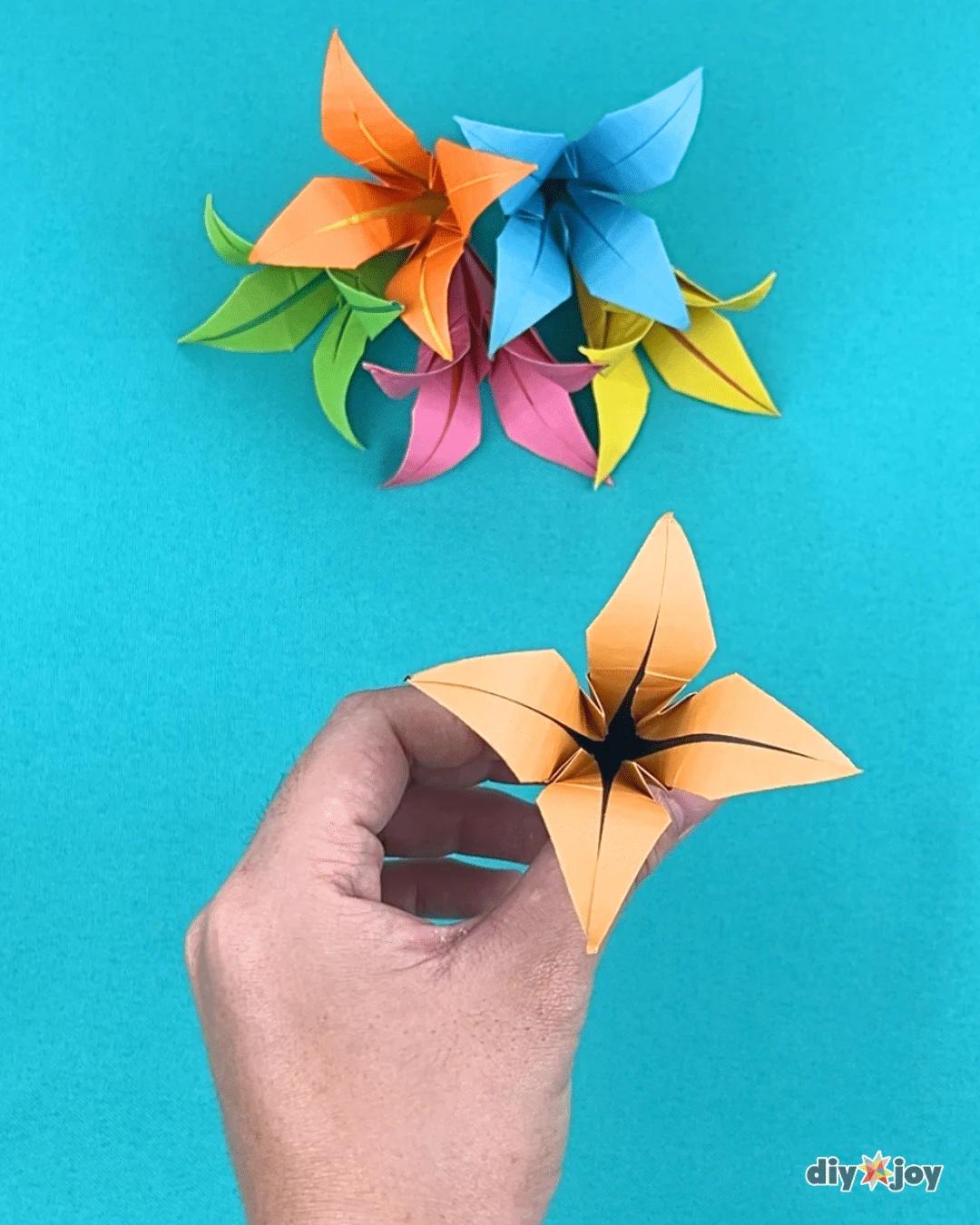 How to make a lily paper flower, the final step curling the petal tips outward with a plain wooden skewer