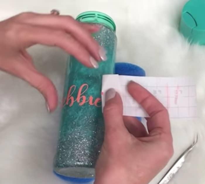 Make a glittered water bottle tumbler from Dollar Tree