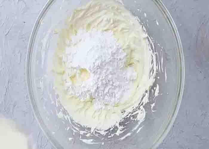 Combining the ingredient for the lemon pudding pie