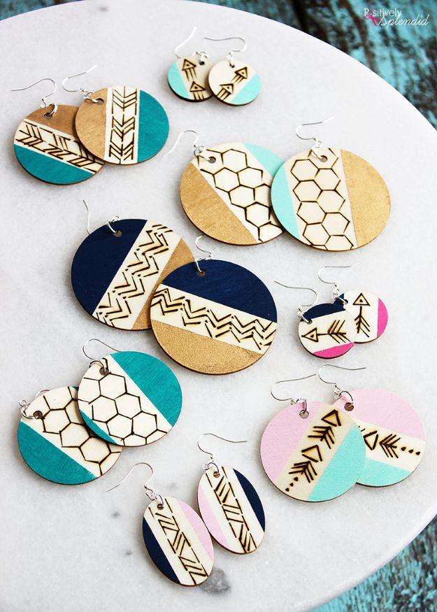 Wood burned earrings, nine pairs of painted wood circles and ovals with burned chevron, arrow and honeycomb patterns