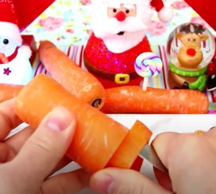 carving carrots to make christmas trees