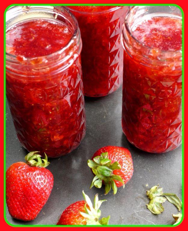 Homemade strawberry jam and pepper jelly in filled canning jars, made in a countertop jam and jelly maker
