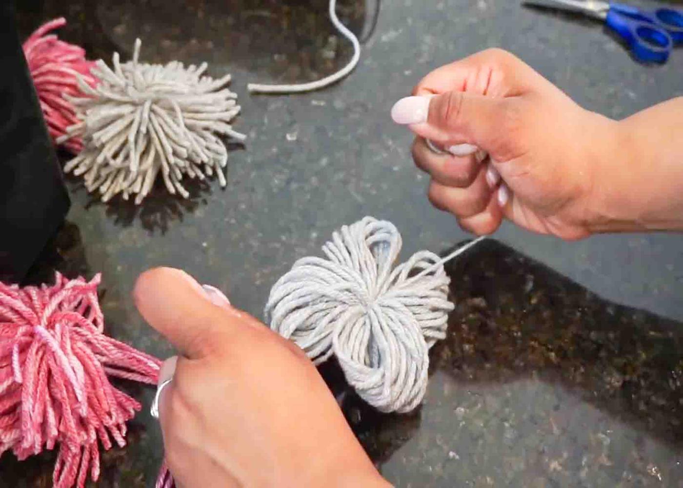 Making the pompoms to be attached to the grip liner.