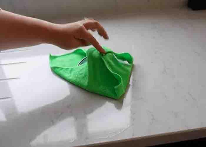 Using a microfiber cloth and a pan lid on cleaning the couch