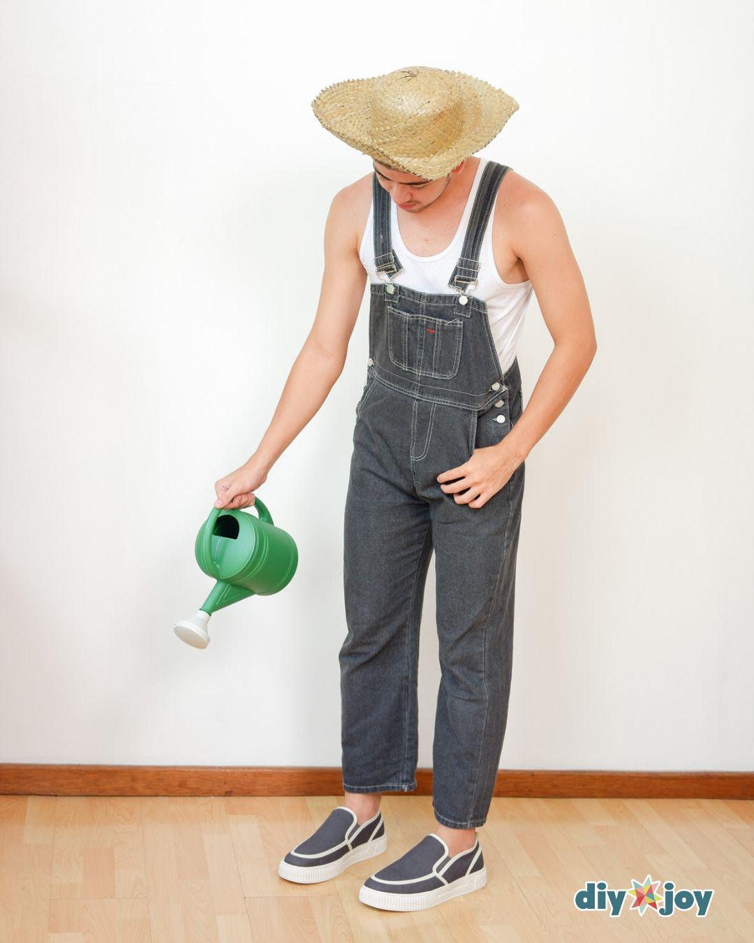Couples Costume Sunflower And Gardener - the gardener half of an easy Halloween costume, overalls, a straw hat, and a can.
