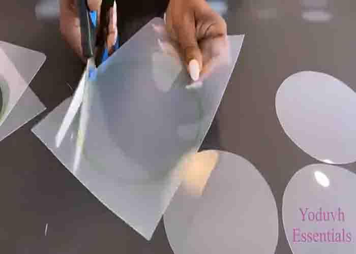 Cutting out the circles in the chopping mats for the chandelier