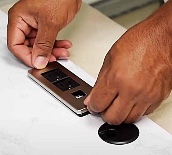 Wall mounted desk with a plug board