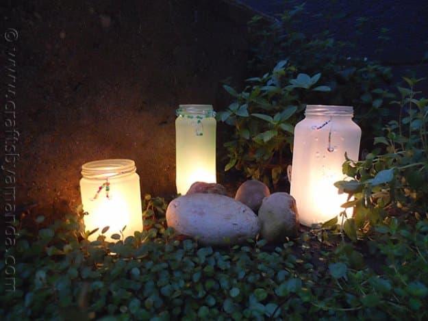 Beaded Frost Mason Jar Luminaries, a budget friendly summer craft idea and a bright accent piece for a porch or patio